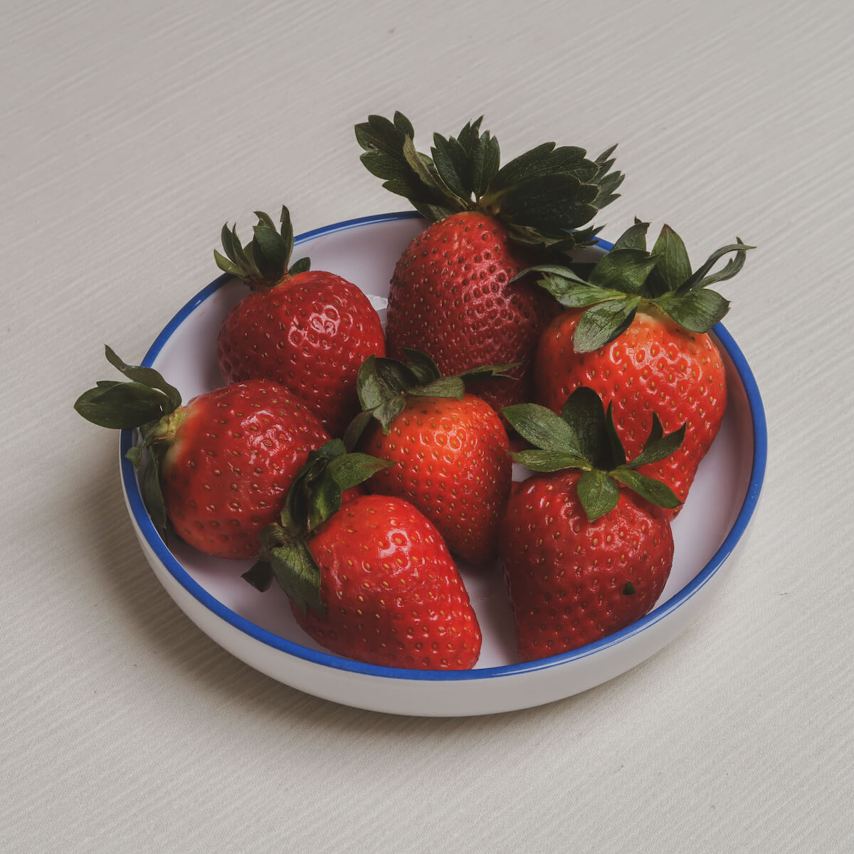 The berries Macro Bowl filled with ripe strawberries.