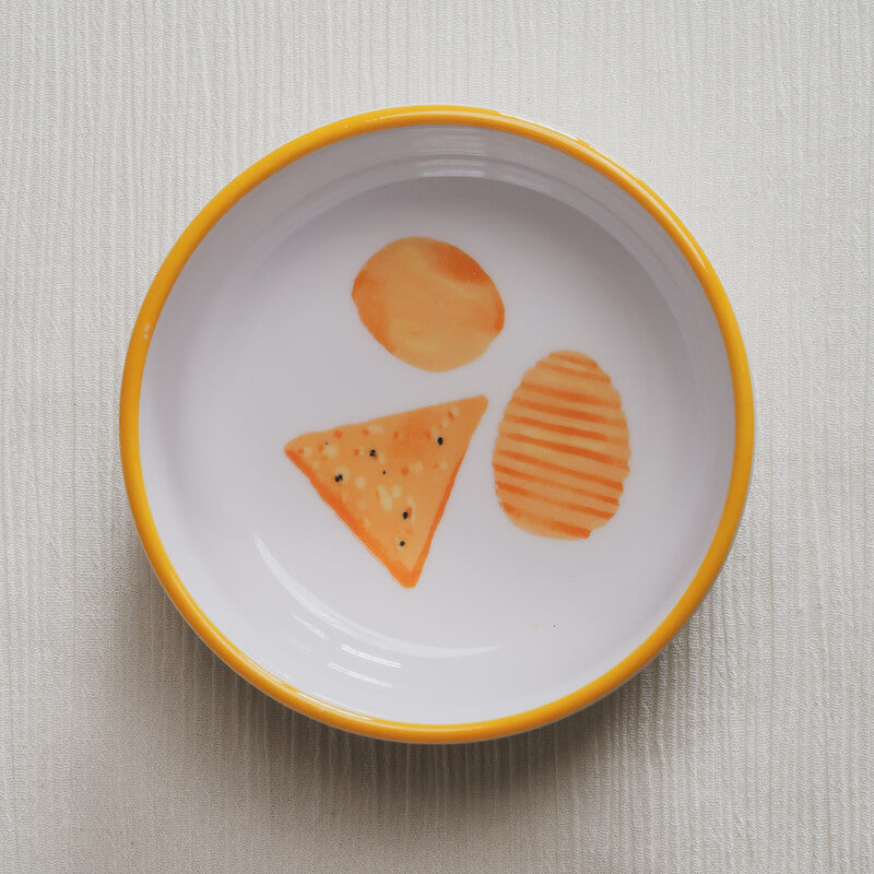 Looking down on the chips Macro Bowl, showing a colorful illustration of different potato chips and tortilla chips at the bottom of the bowl.