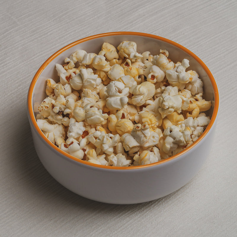 The popcorn Macro Bowl filled with buttered popcorn.