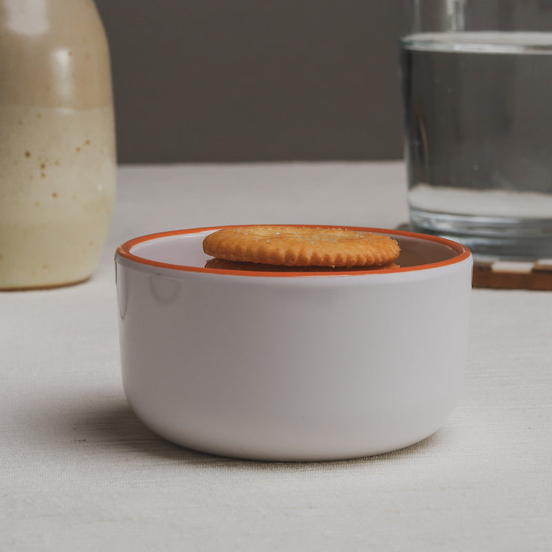 The Macro crackers bowl filled to the top with golden round crackers.