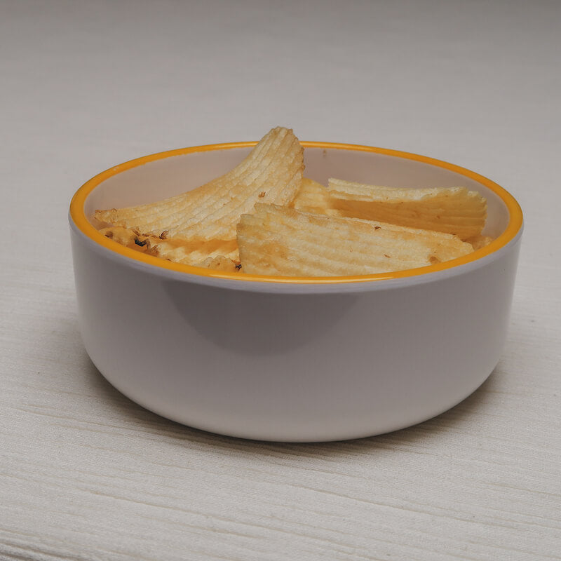 A slightly angled view of the chips Macro Bowl filled with potato chips.