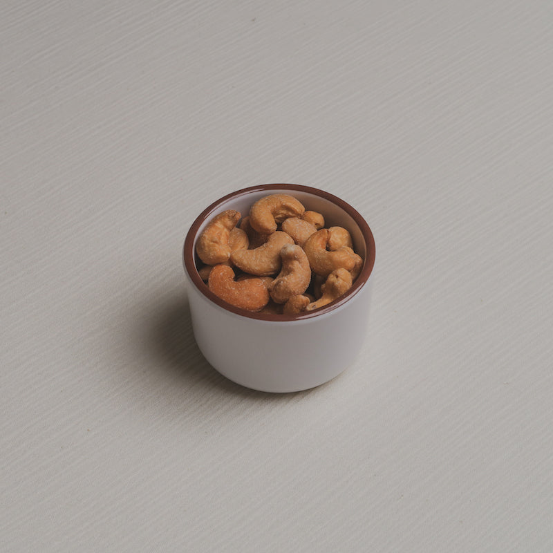 A slightly angled view of the nuts Macro Bowl filled with cashews.