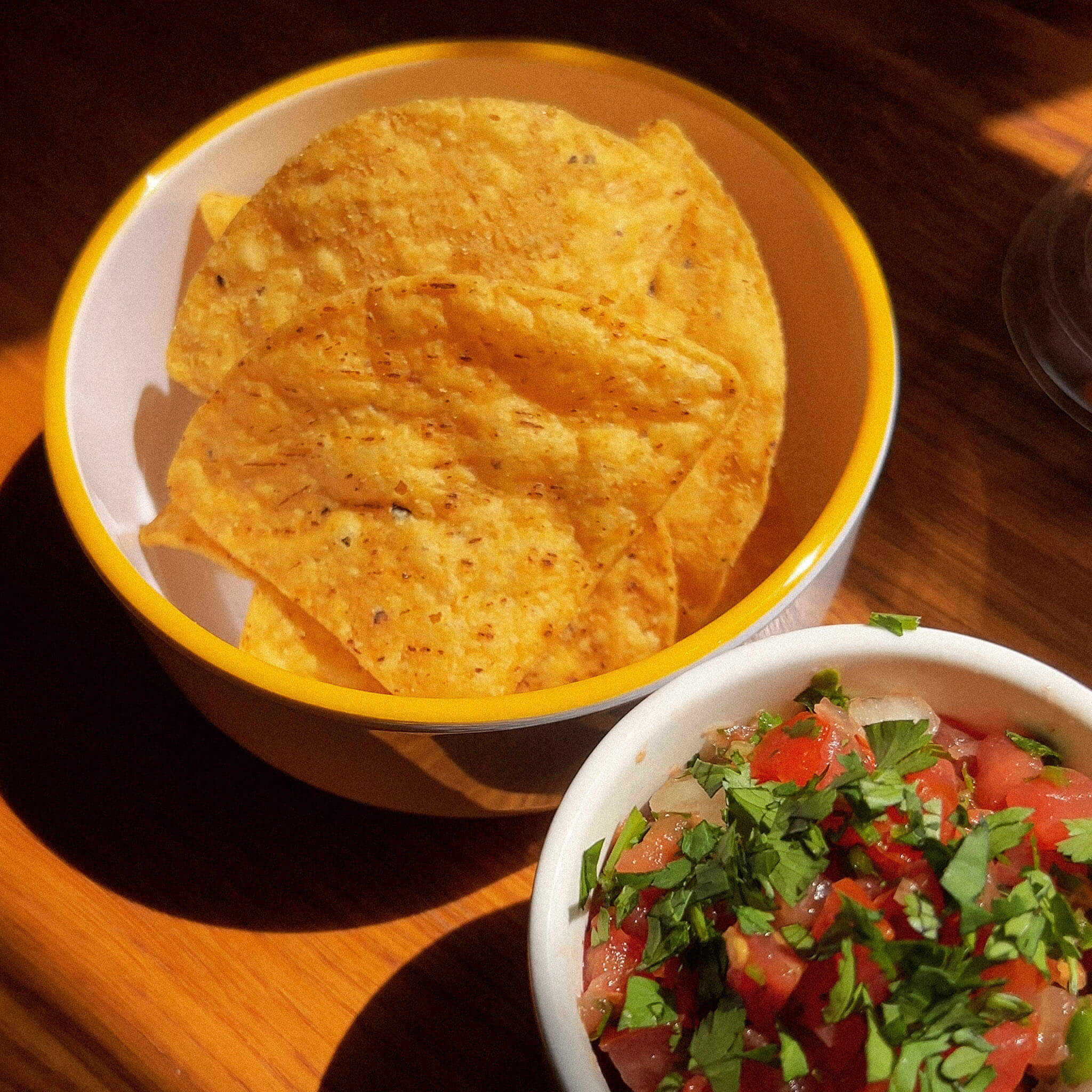 Tortilla chips and pico de gallo salsa.